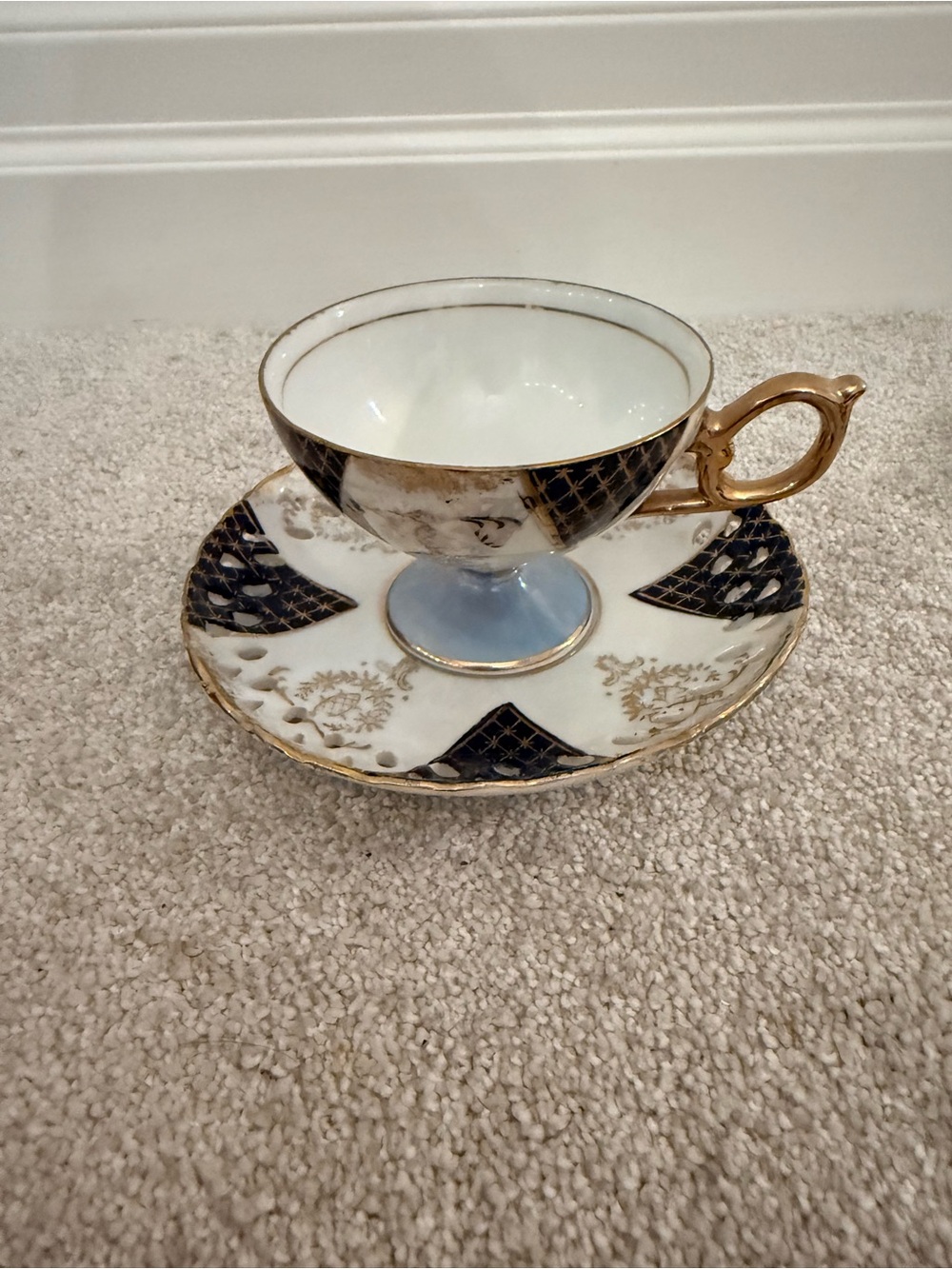 Elegant Gold-Trimmed Black and White Teacup and Saucer made in Japan